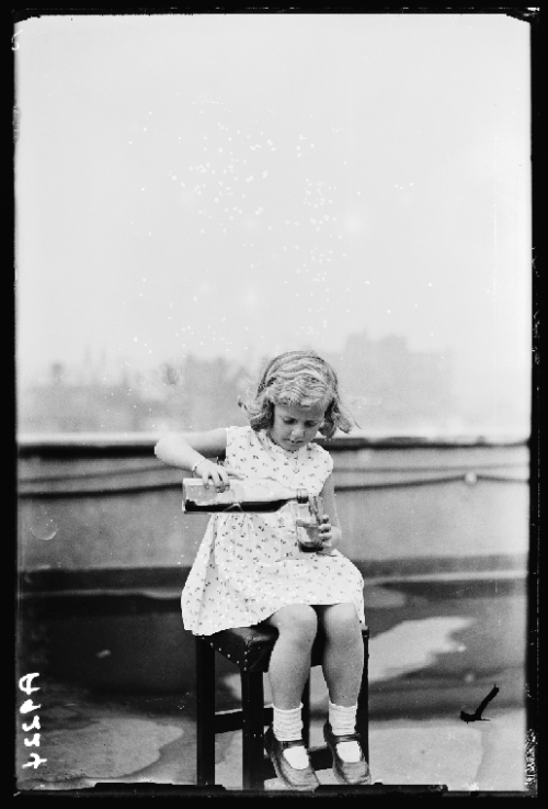 little girl pouring whisky